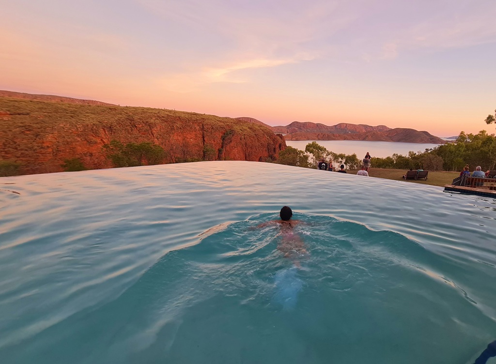 Swimming in the Lake Argyle infinity pool with its stunning background
