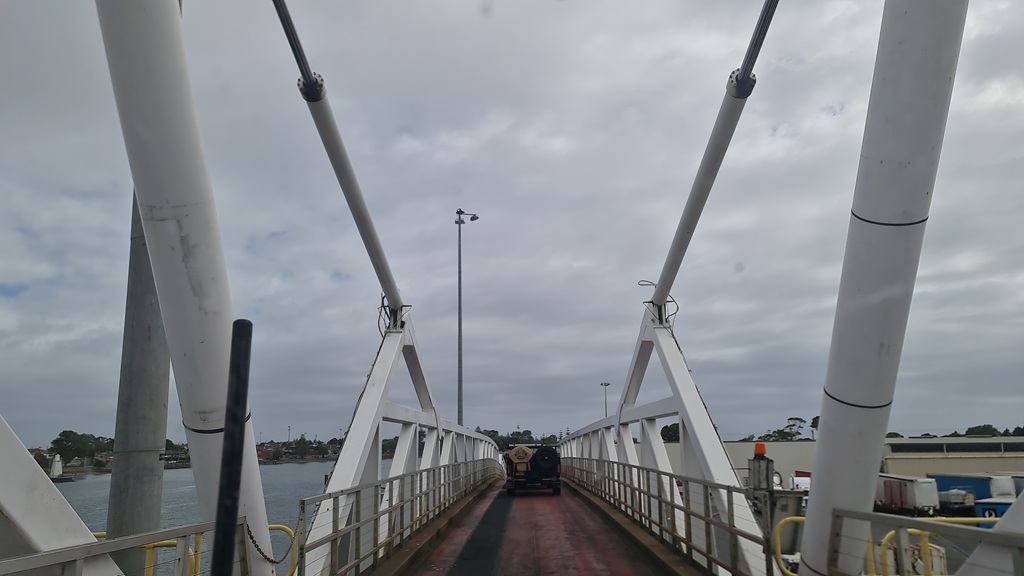 Driving a car and caravan off the Spirit of Tasmania ramp at the Devonport terminal.