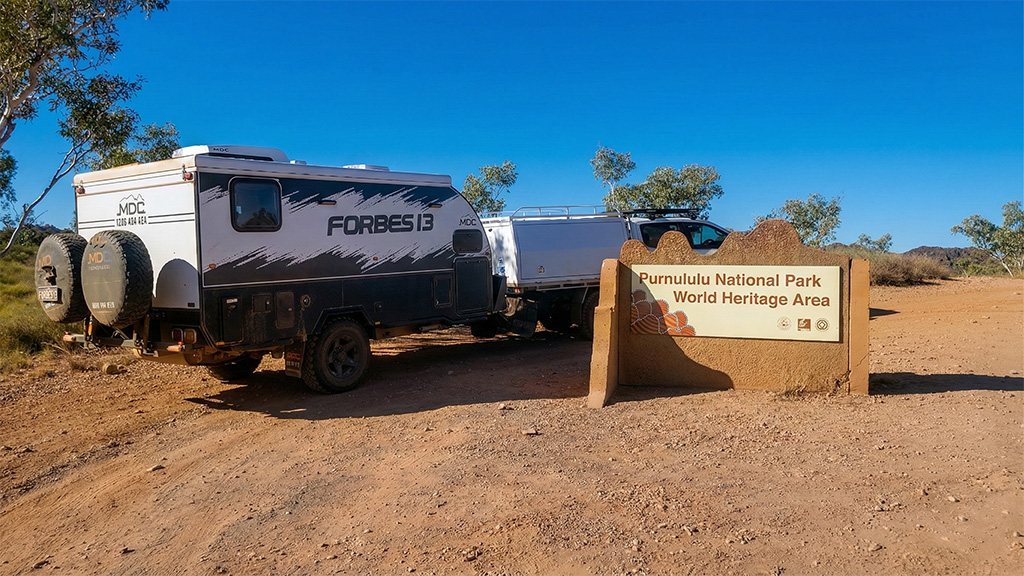 A 4WD towing a hybrid caravan parked next to the