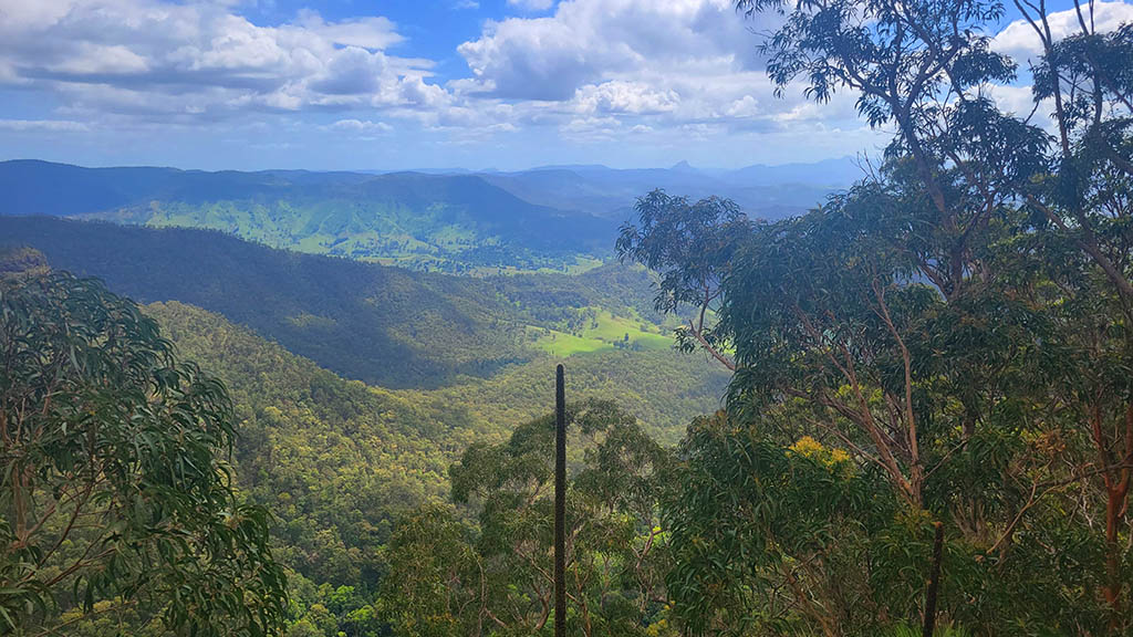 View over forested valleys and distant mountains from Python Rock Lookout in Lamington National Park